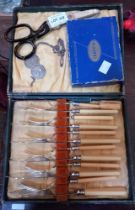 A box of fish knives and forks, two St Christopher's, pinking shears and canasta