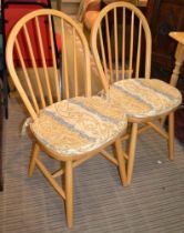 A set of four beech hoop back kitchen chairs