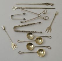 Three silver tongs, two silver skewers, two silver pickle forks, four salt spoons, weight: 93g (incl