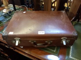 A small evacuee's suitcase containing a selection of postcards