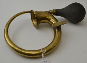 A brass scroll bulb car horn