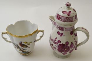 A German porcelain two handled cup, hand painted bird and butterfly decoration, monogrammed for Augu