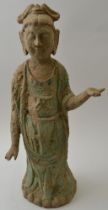 A Chinese earthenware Sung style Guanyin figure, with remains of painted decoration, 45cm high