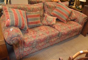 A "Duresta" two seater sofa and matching easy chair, upholstered in a Persian style fabric