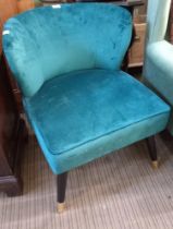 A modern low upholstered horseshoe back chair