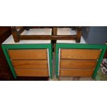 A pair of modern green metal framed three drawer chests