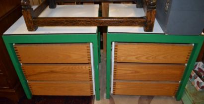 A pair of modern green metal framed three drawer chests