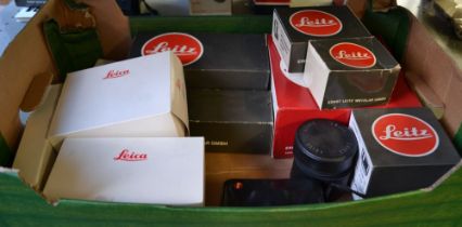 A "Leica" Elmar mini camera, two lens extenders, a universal hand grip, winder, empty boxes etc