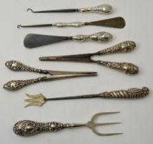 Seven various silver handled items bread fork, pickle fork, shoe horn, glove stretchers, etc.