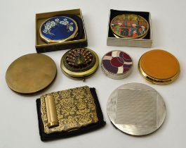 A Stratton brass decorative compact, with integral lipstick holder, together with Stratton and other