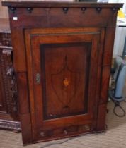 A 19th century corner cupboard with shell decoration and two doors