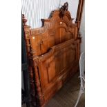 A possible walnut ornately carved a decorated double bed