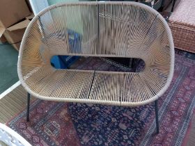A modern two seater plastic strung garden or conservatory seat