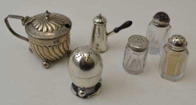 A Victorian silver egg shaped pepper, London 1894, together with four various peppers, and a Victori