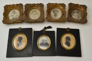 A pair of 19th century silhouettes, oval mounted within ebonised frames with gilt brass floral ring