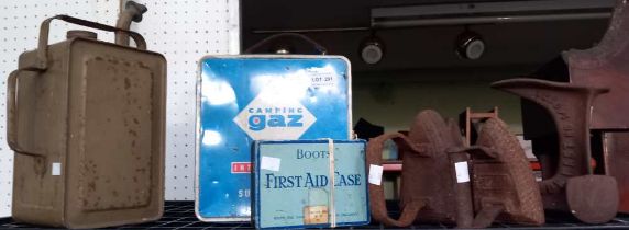 A Camping Gaz tin, Boots First Aid tin, Esso Blue can, shoe last & flat irons