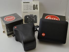 A "Leica" R5 35mm SLR camera body, fitted with a "Leitz" Vario-Elmar-R 35-70 lens, in leather case w