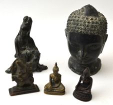 A hollow cast bronze head of Buddha, patinated finish 13cm high, together with four smaller figure o