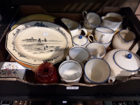 A box containing a Poole studio design tea set with other porcelain items