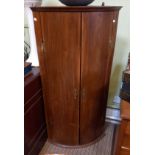 Large 20th century bow front corner cupboard
