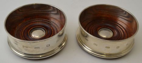 A pair of Georgian design silver bottle coasters, London 2004, 9cm in diameter