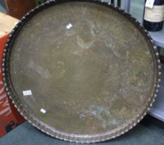 A large brass plate possible table top