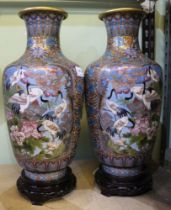 Modern large pair of cloisonné vases with wooden stands