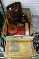 A box containing a vintage hair dryer, cased binoculars and other collectible items