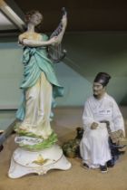 Two porcelain male and female figures one Oriental the other Continental