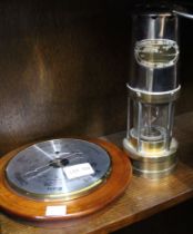 An E Thomas & Williams Ltd miners lamp together with a circular barometer