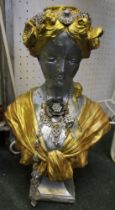 A plaster bust of a lady painted silver and gold