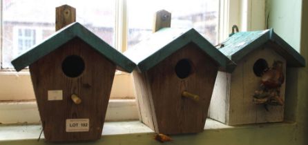 Three wooden bird boxes