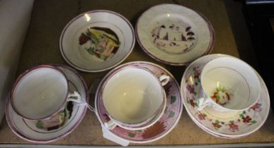 A box containing various early 19th century lustreware cups & saucers