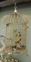 A metal gilded decorative bird cage
