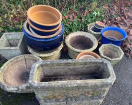 A selection of stone, porcelain and terracotta planters