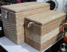 Two wicker lidded storage baskets