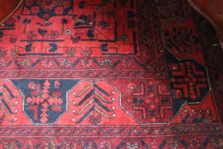 Hand knotted floral carpet with busy central field within triple guard boarders