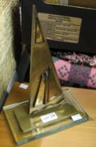 A bronze desk ornament in the form of a yacht sail, limited edition 3 of 300, indistinctly signed