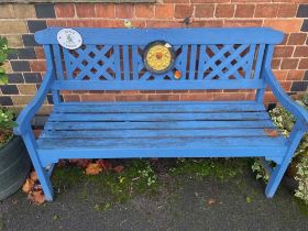 A blue painted garden bench