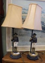 A pair of table lamps, in the form of two uniformed gentlemen