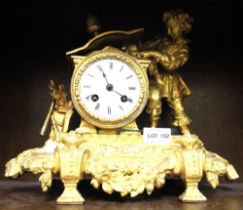 An ornate gilt mantle clock