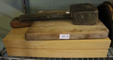 'Rustic' wooden chopping board an empty oak cutlery canteen and a wooden mallet