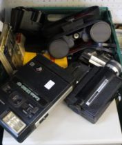 A crate containing a selection of photographic equipment