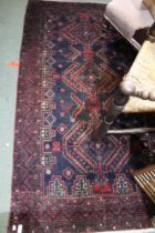 Dark ground hand knotted floor rug 107 x 197cm