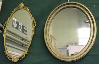 Two gilt framed oval wall hanging mirrors