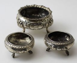 Daniel and Charles Houle, a Victorian silver salt, embossed floral decoration, raised on three pad f