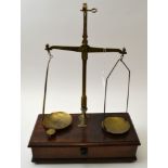 "W & T Avery Ltd" of Birmingham, a brass balance scale, on mahogany box base, fitted drawer contains