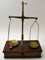 "W & T Avery Ltd" of Birmingham, a brass balance scale, on mahogany box base, fitted drawer contains