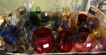 A box containing a selection of coloured drinking glasses