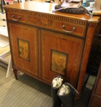 A Maple and Co satinwood veneer cabinet in the Sheraton taste fitted drawer over two doors